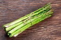 Fresh bunch asparagus on wooden table background