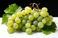 Fresh bunch of grapes with leaves isolated on a white Royalty Free Stock Photo