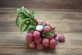 Fresh juicy lychee fruit, peeled to show the flesh white on wood background. Royalty Free Stock Photo