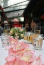 a Fresh bunch of pink peonies and roses at wedding table