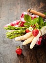 Fresh bunches of green and white asparagus tips