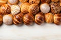 Fresh buns, cheesecakes on a light background, top view, with copy space. Bakery.