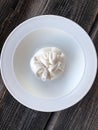Fresh burata cheese in a white plate Royalty Free Stock Photo