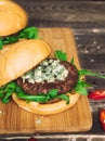 Fresh burger with blue cheese and arugula Royalty Free Stock Photo