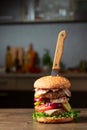 Fresh burger with knife on a kitchen table
