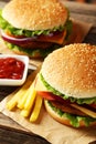 Fresh burgers on the wooden background