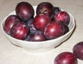 the bowl of burgundy plums