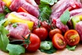 Fresh butcher cut and tomatoes meat assortment garnished Royalty Free Stock Photo