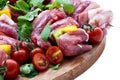 Fresh butcher cut and tomatoes meat assortment garnished Royalty Free Stock Photo