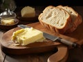 fresh butter cut into pieces and bread on the wooden plate Royalty Free Stock Photo