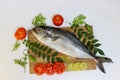 Fresh Butter Fish Amberjack Fish Allied kingfish (Seriola Dumerilli) Decorated with herbs and vegetables. Royalty Free Stock Photo