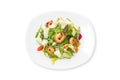 Fresh caesar salad with shrimps on a white plate isolated. Royalty Free Stock Photo