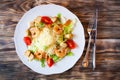 Fresh caesar salad on white bowl with parmesan cheese and shrimp Royalty Free Stock Photo