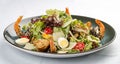 Fresh caesar salad on white bowl with parmesan cheese and shrimps. In a decorative plate Royalty Free Stock Photo