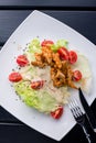 Fresh caesar salad on white bowl with parmesan cheese and shrimps Royalty Free Stock Photo