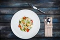 Fresh caesar salad on white plate with parmesan cheese and shrimps. Top view Royalty Free Stock Photo