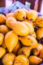 Fresh canistel fruits on stall Royalty Free Stock Photo