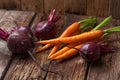 Fresh carrot, beet on a wooden rustic table.