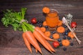 Fresh carrot and carrot juice or organic healthy juice in glass , tomato ,blueberries