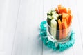 Fresh carrot and cucumber sticks in a glass. Centimeter measurement of volume. Concept of dietary nutrition. Copy space