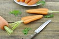 Fresh carrot and double cut on wooden table rustic Royalty Free Stock Photo