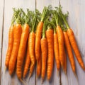 Fresh carrot harvest arranged in an appealing bunch on wooden table Royalty Free Stock Photo