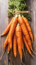 Fresh carrot harvest arranged in an appealing bunch on wooden table Royalty Free Stock Photo