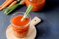 Fresh Carrot Juice in a Glass on a Dark Grey Background Healthy Drink Detox Diet Juice Glass of Tasty Carrot Juice on Wooden Board