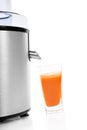 Fresh carrot juice with juicer. Royalty Free Stock Photo