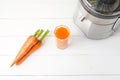 fresh carrot juice with juicer Royalty Free Stock Photo