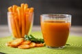 fresh carrot juice and slices of carrots Royalty Free Stock Photo