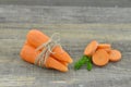 Fresh carrot and cuts slices of carrot on wooden Royalty Free Stock Photo