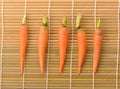Fresh carrots on bamboo floor Royalty Free Stock Photo