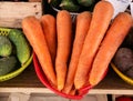 Fresh carrots in plastic bowls on the counter. Sale of carrots at the farmers\' market. Close-up Royalty Free Stock Photo