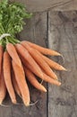 Fresh carrots on rustic wooden