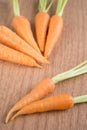 Fresh carrots on wooden background Royalty Free Stock Photo