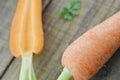 Fresh carrots with cut carrot on wooden rustic Royalty Free Stock Photo