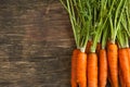 Fresh carrots on wooden background Royalty Free Stock Photo