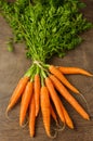 Fresh carrots on wooden table