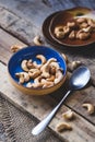 Fresh Cashew nuts on the dark background