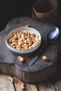Fresh Cashew nuts on the dark background