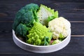 Fresh cauliflower, broccoli and romanesco broccoli on a round tray. the concept of a healthy lifestyle. top view. copy space Royalty Free Stock Photo