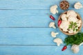 Fresh cauliflower with garlic and chili peppers on blue wooden background with copy space for your text. Top view Royalty Free Stock Photo