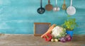 Fresh cauliflower,vegetables,kitchen blackboard, utensils,food,cooking,eating concept,free copy space