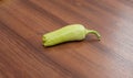 Fresh cayenne green pepper on wooden table