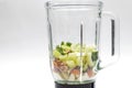 Fresh Celery, avocado, almonds, pears in a glass blender for cooking a green smoothie