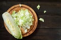 Fresh celery cabbage on a vintage wooden fone.