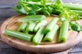 Fresh celery stems on wooden cutting board Royalty Free Stock Photo