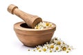 Fresh chamomile flowers in wooden mortar on white background. Generative AI