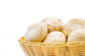 Fresh champignons, champignon mushrooms in wicker basket isolated Royalty Free Stock Photo